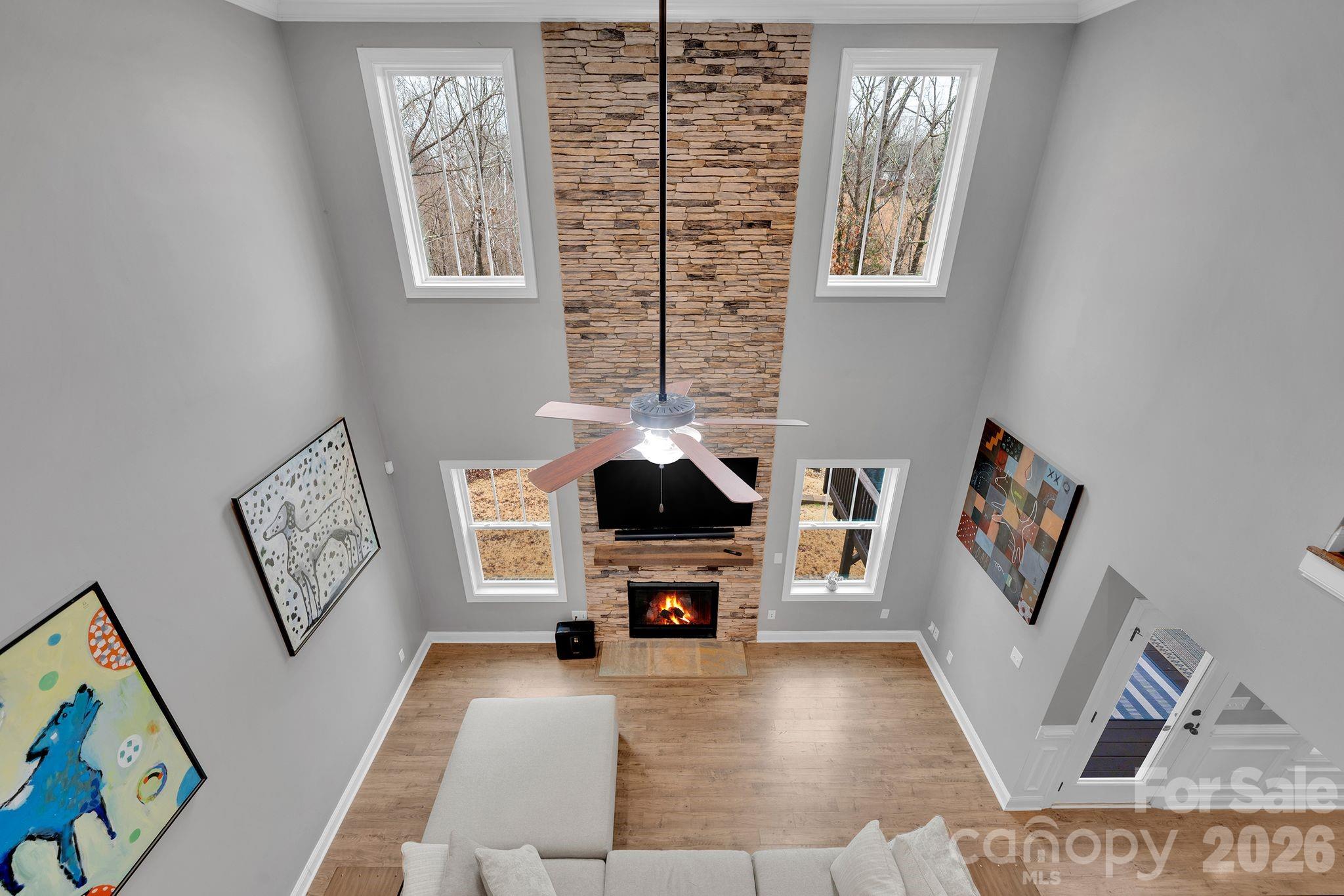 663 Highland Ridge Point Lake Wylie, SC 29710 - Photo 21 of 42 a living room with furniture and a fireplace