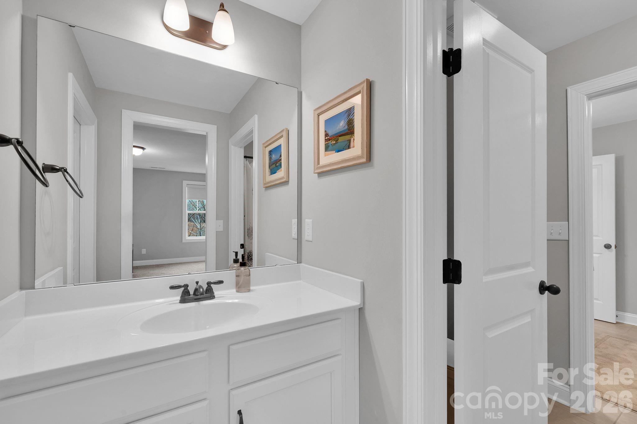 663 Highland Ridge Point Lake Wylie, SC 29710 - Photo 26 of 42 a bathroom with a sink and a mirror