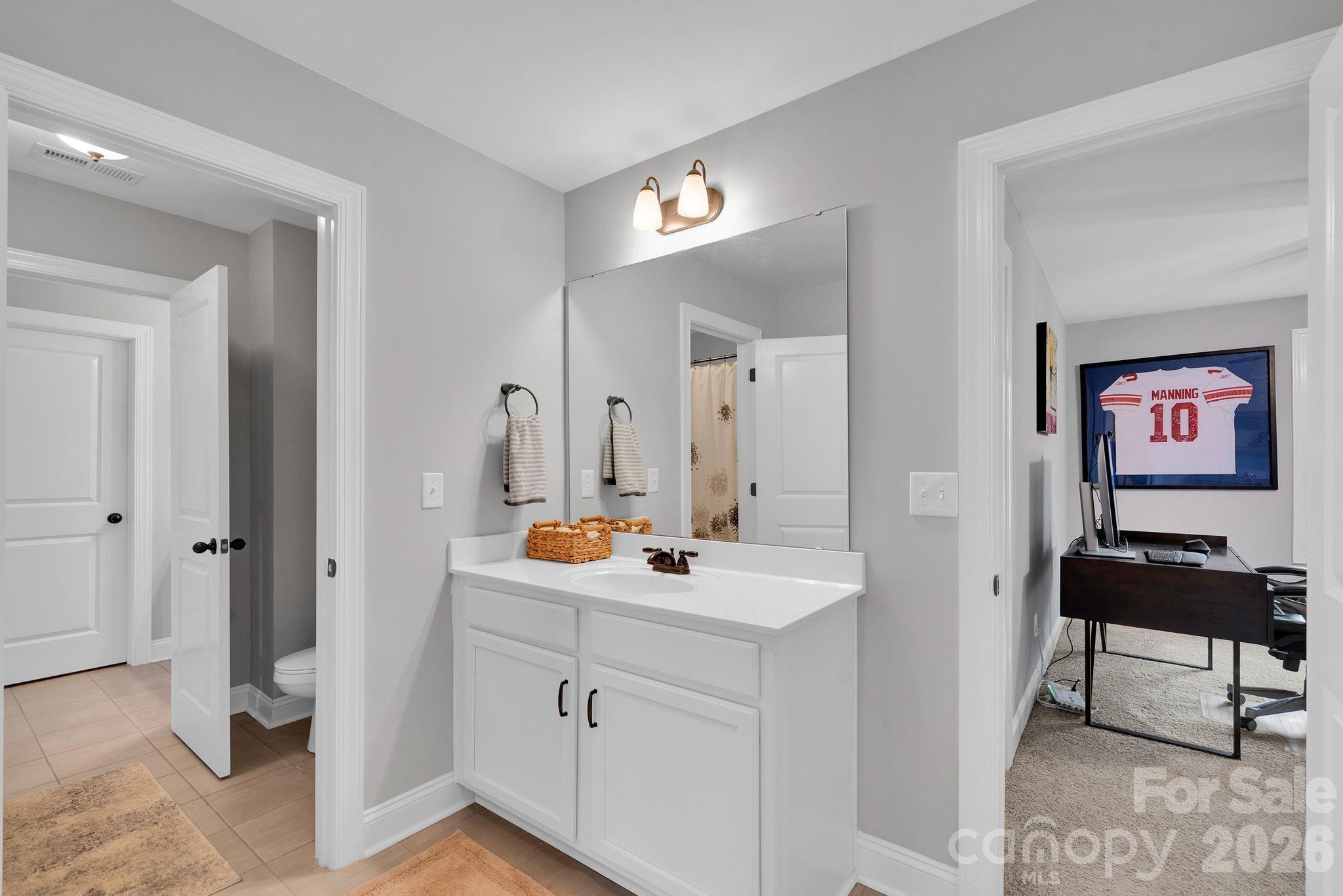 663 Highland Ridge Point Lake Wylie, SC 29710 - Photo 29 of 42 a bathroom with a sink and a mirror