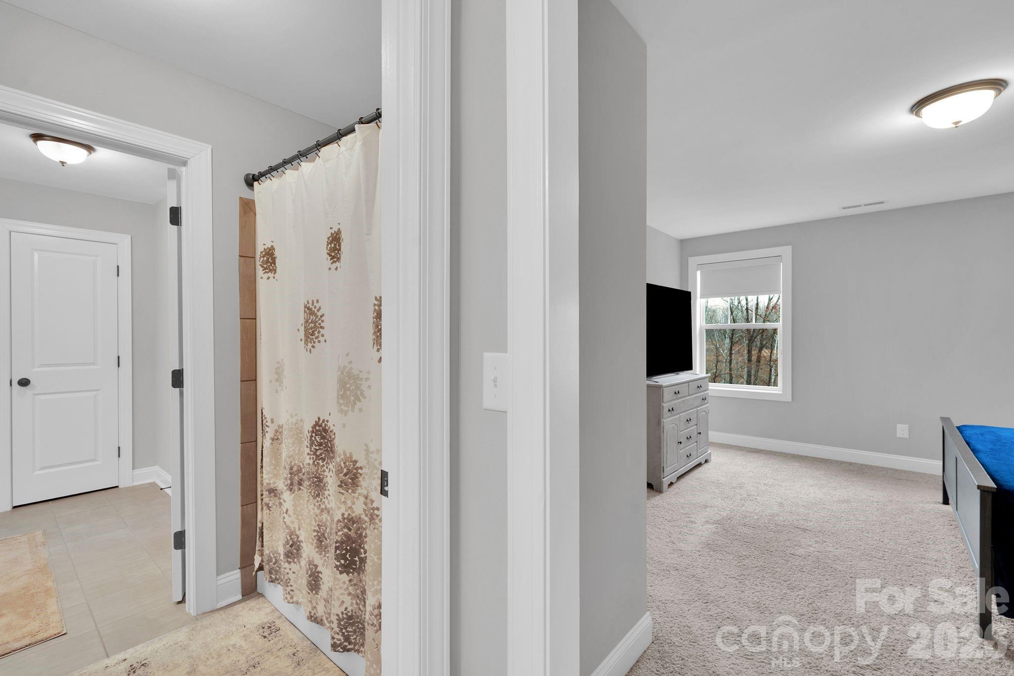 663 Highland Ridge Point Lake Wylie, SC 29710 - Photo 30 of 42 a view of a bathroom with a shower and a sink