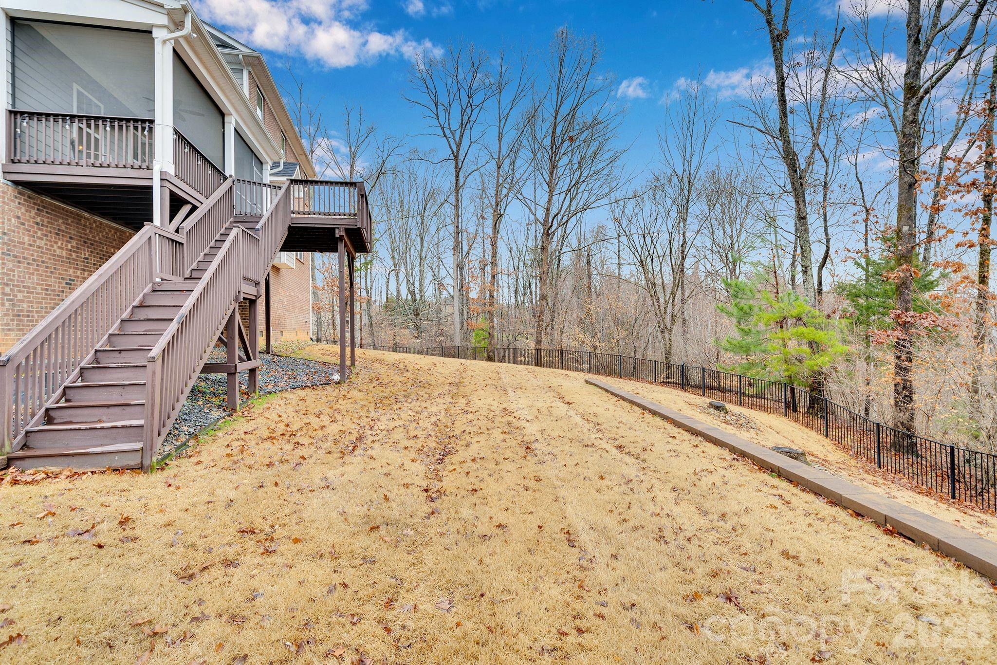 663 Highland Ridge Point Lake Wylie, SC 29710 - Photo 38 of 42 a house with trees in front of it