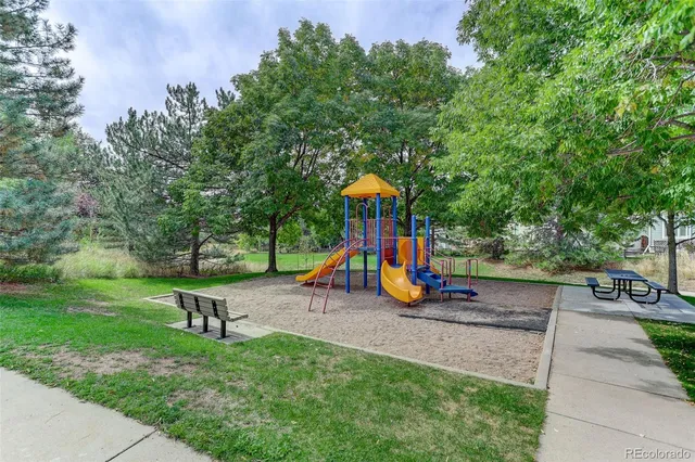 a view of a park with large trees