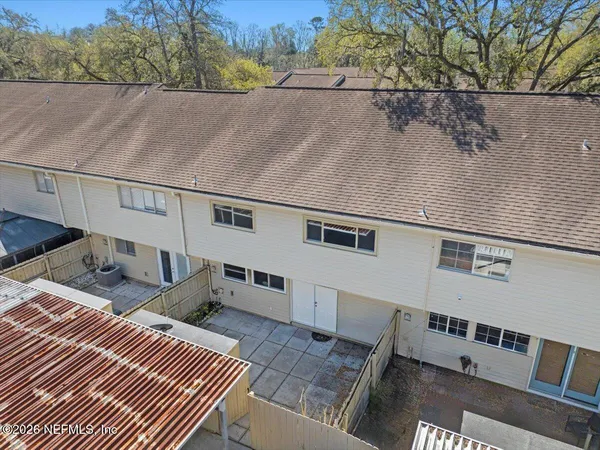a view of a park with large trees