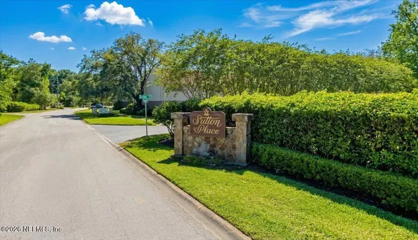 a room with furniture pool table and wooden floor