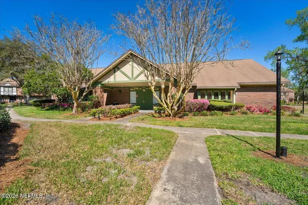 a kitchen with stainless steel appliances granite countertop a refrigerator sink and stove