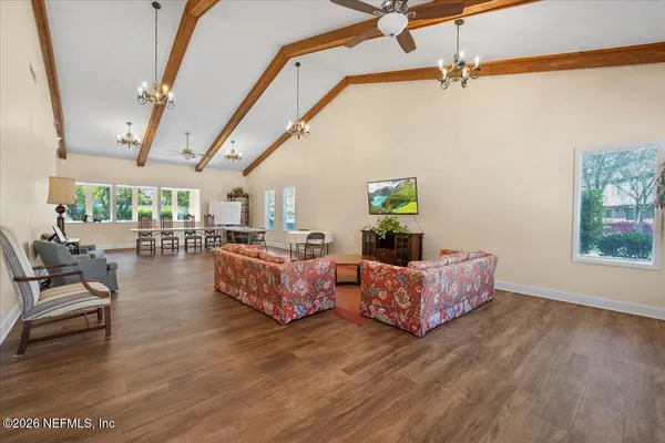 a room with gym equipment and large mirror