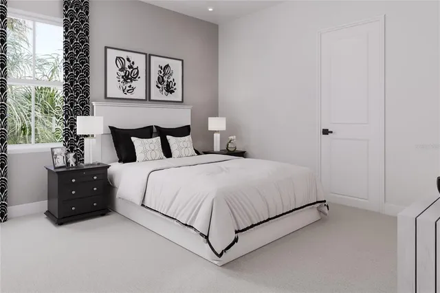 a bedroom with a bed and a night stand