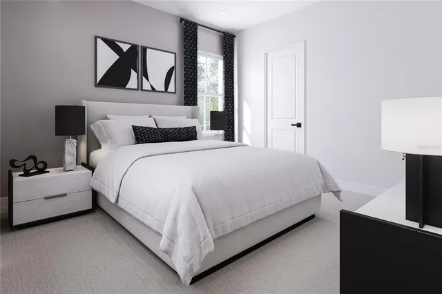 a bedroom with a bed and a lamp on table