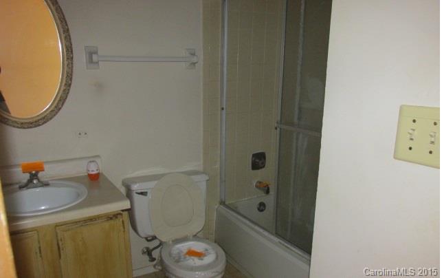4720 Cheviot Road Charlotte, NC 28269 - Photo 11 of 15 a bathroom with a sink a toilet and shower