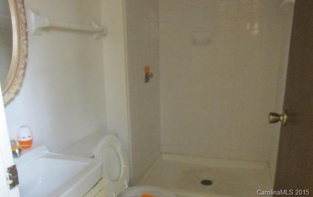 4720 Cheviot Road Charlotte, NC 28269 - Photo 15 of 15 a bathroom with a bathtub
