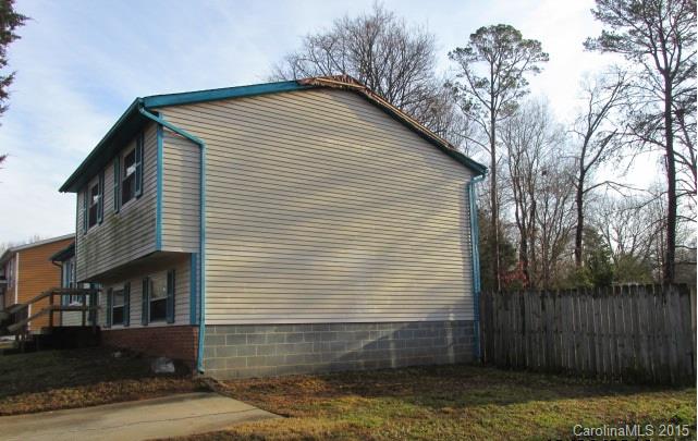 4720 Cheviot Road Charlotte, NC 28269 - Photo 3 of 15 a front view of a house with a yard