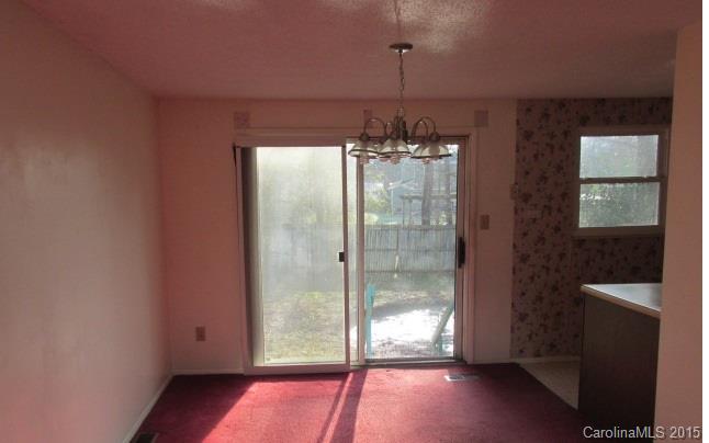 4720 Cheviot Road Charlotte, NC 28269 - Photo 6 of 15 a view of a room with a window and chandelier
