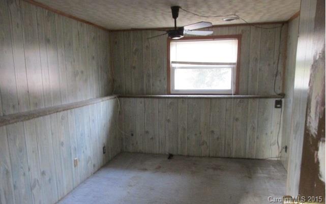 4720 Cheviot Road Charlotte, NC 28269 - Photo 9 of 15 an empty room with windows