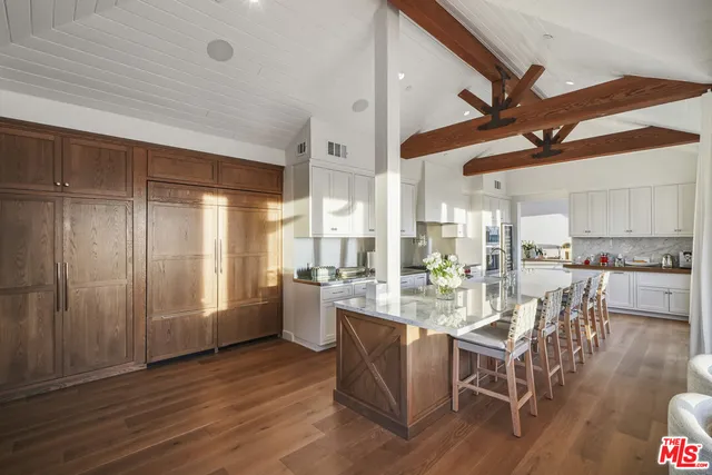 a bedroom with a bed and glass window