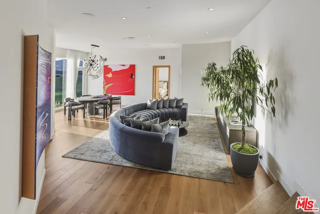 a view of kitchen with furniture and wooden floor