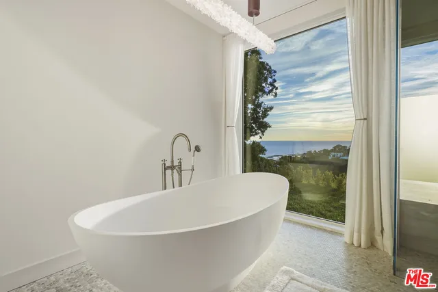 a view of a balcony with a door and a window