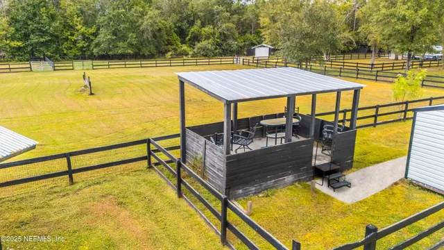 a view of a swimming pool with a yard