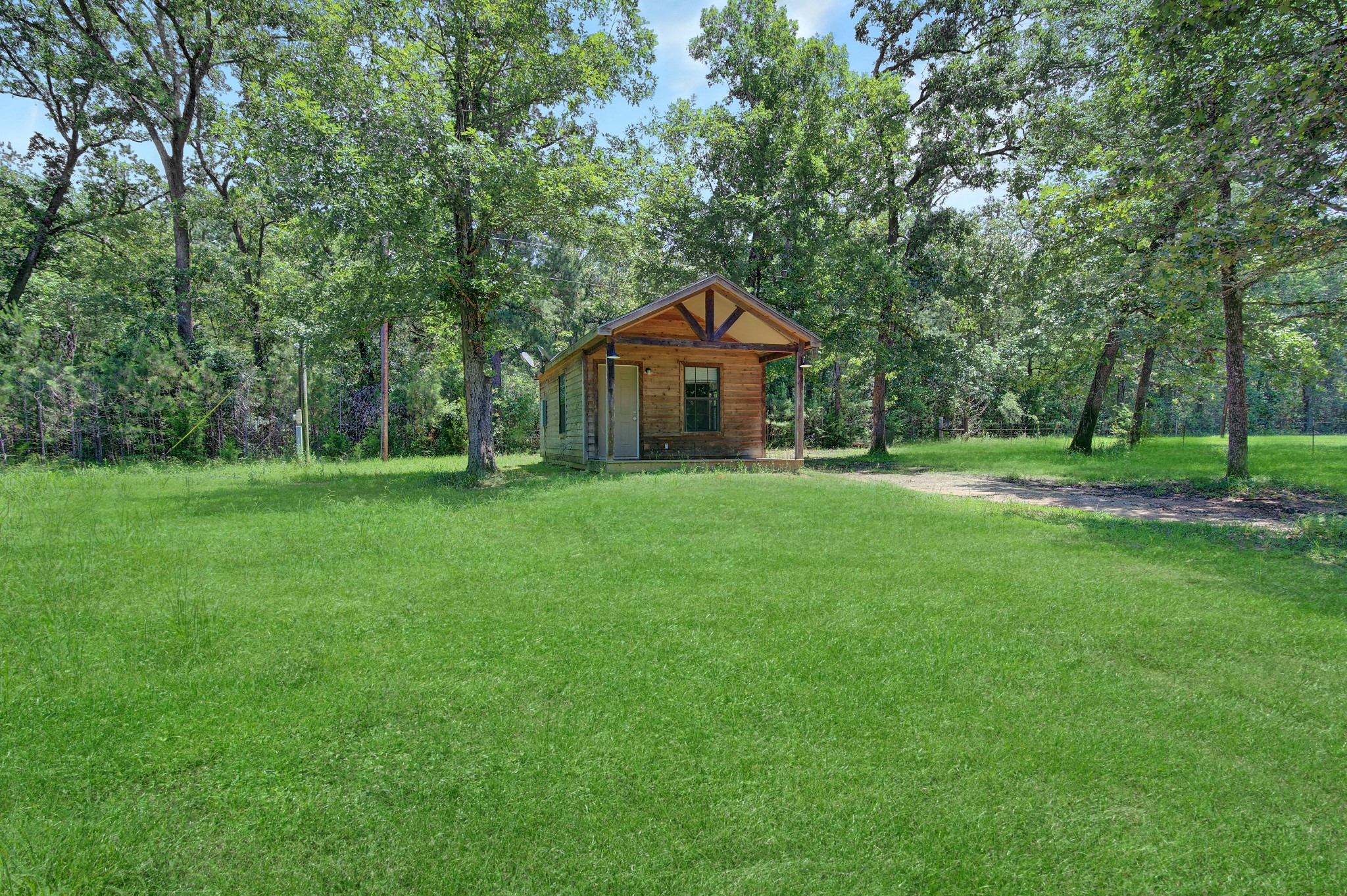 10521 Tanyard Road, Unit SM Willis, TX 77378 - Photo 11 of 11 The property is shared with multiple residences, but you'll have access to the 40 feet in all directions of your cozy cabin.