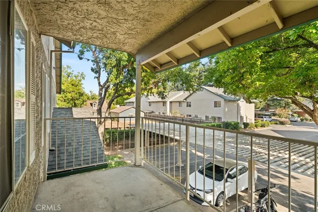 a view of a balcony with a tree