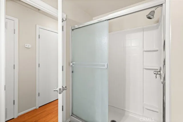 a view of room with hardwood floor and closet
