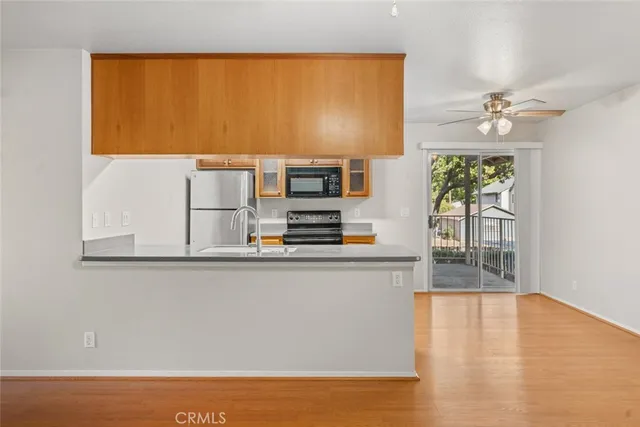 a view of kitchen with furniture and wooden floor