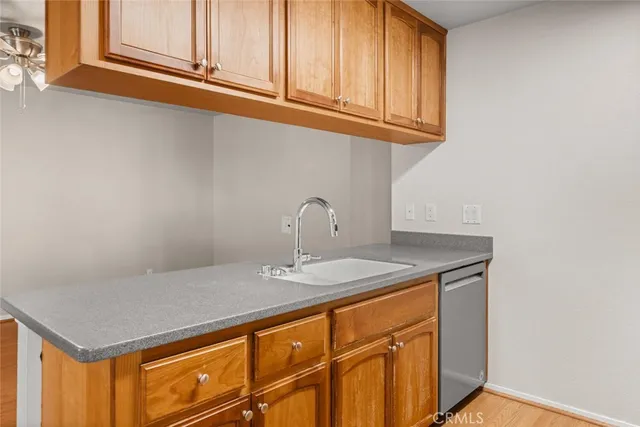 a close view of a sink and cabinets