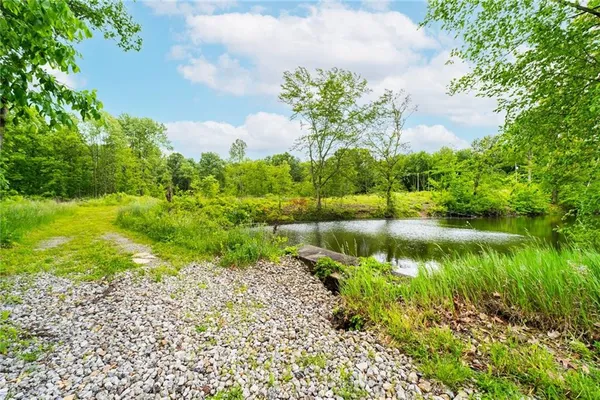 a view of a lake with a yard