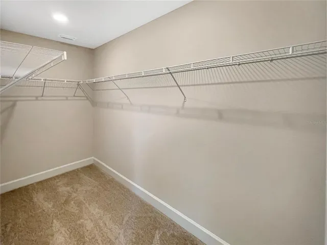 a view of a room with racks on the wall