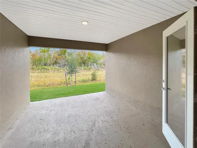 a view of a room with a large window