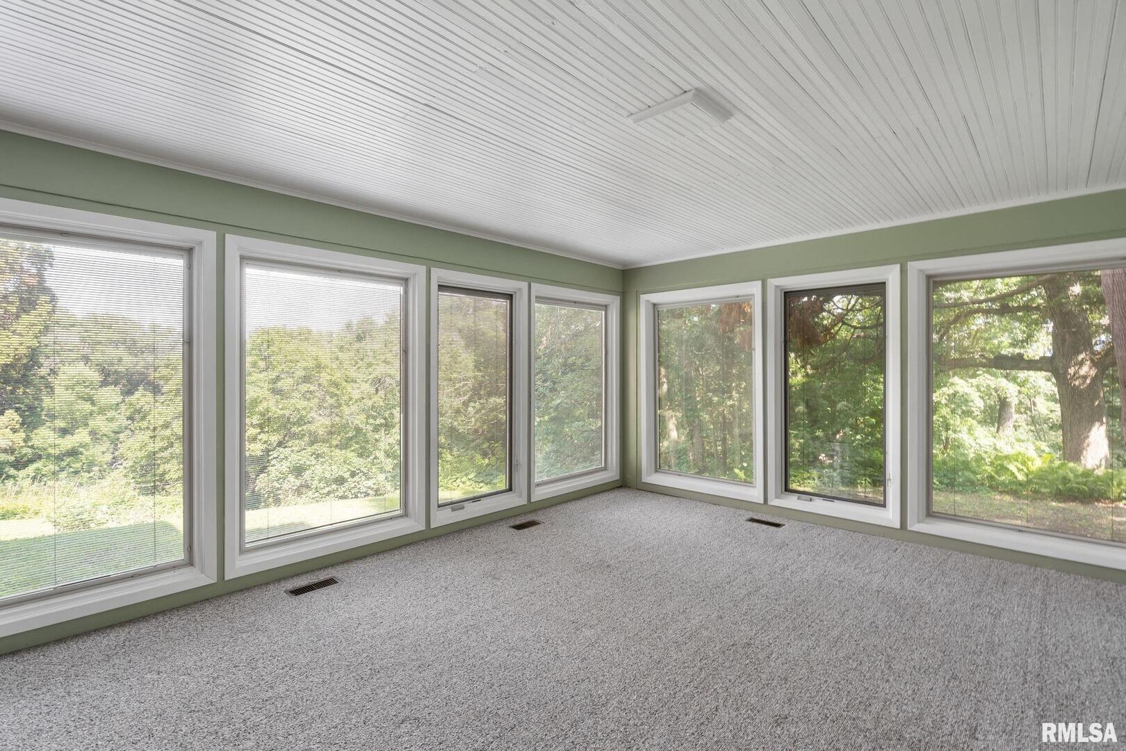 5418 Chapel Hill Road Davenport, IA 52802 - Photo 12 of 69 a view of a room with large windows