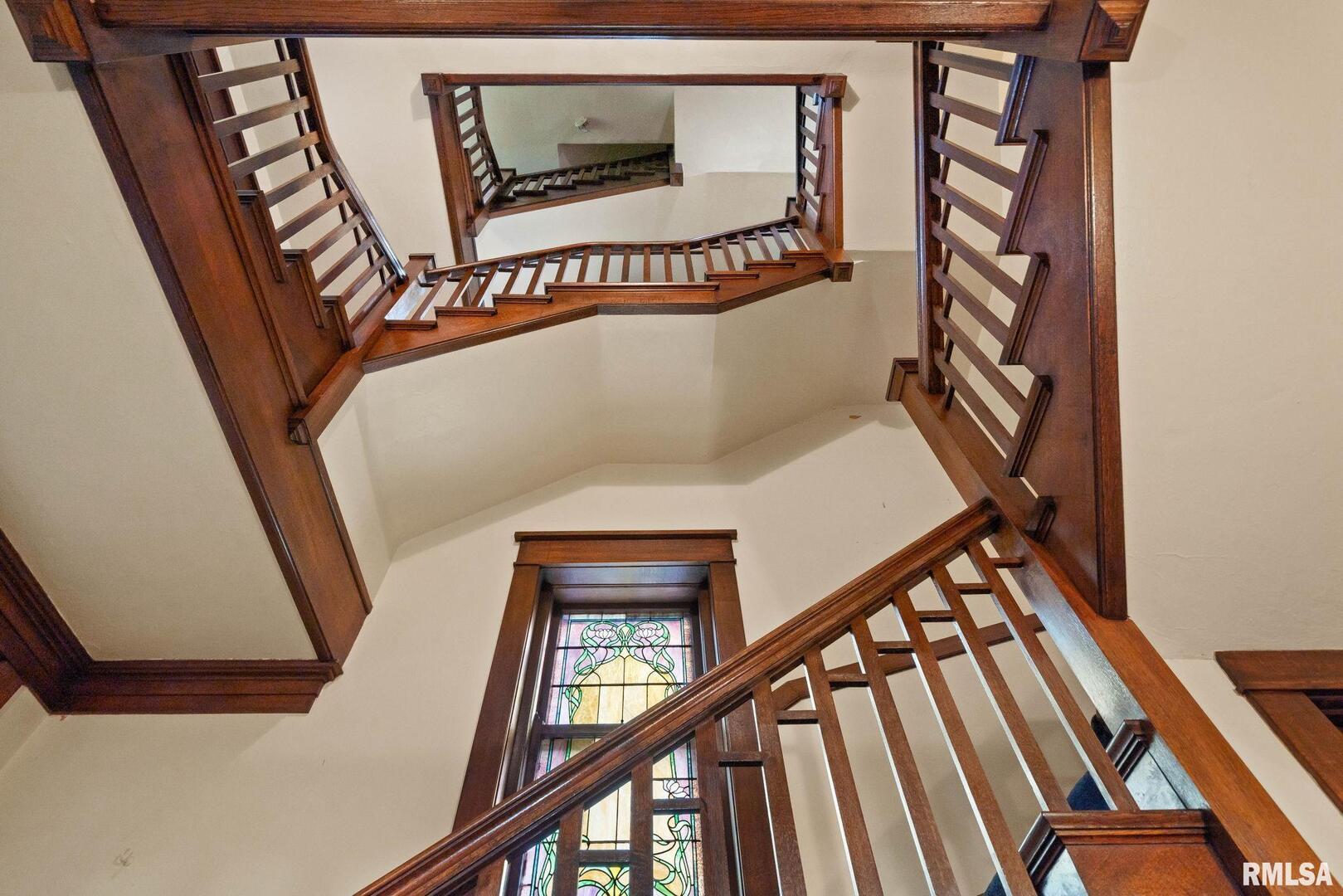 5418 Chapel Hill Road Davenport, IA 52802 - Photo 13 of 69 a view of staircase with railing and white walls