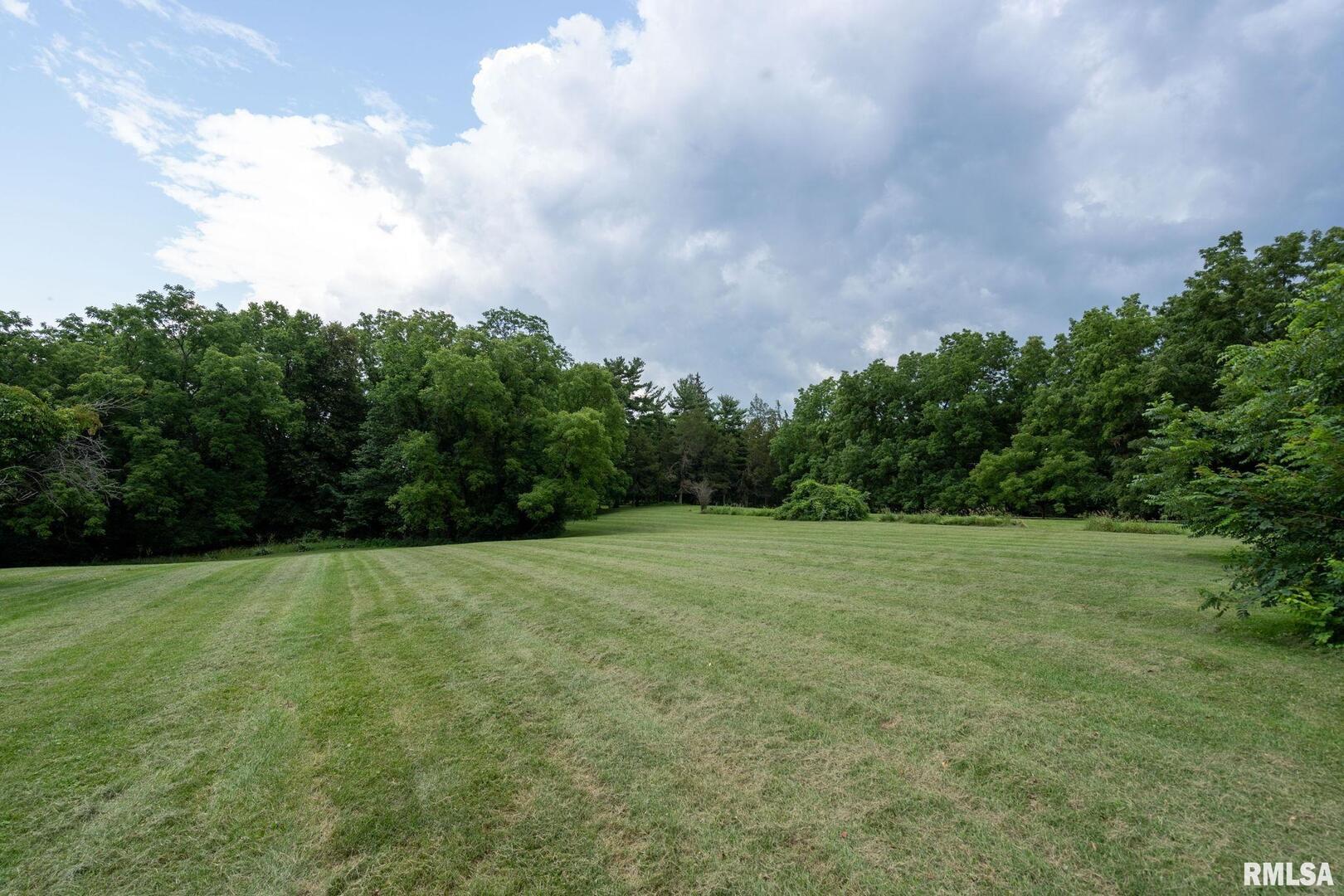 5418 Chapel Hill Road Davenport, IA 52802 - Photo 26 of 69 a view of an outdoor space and a yard