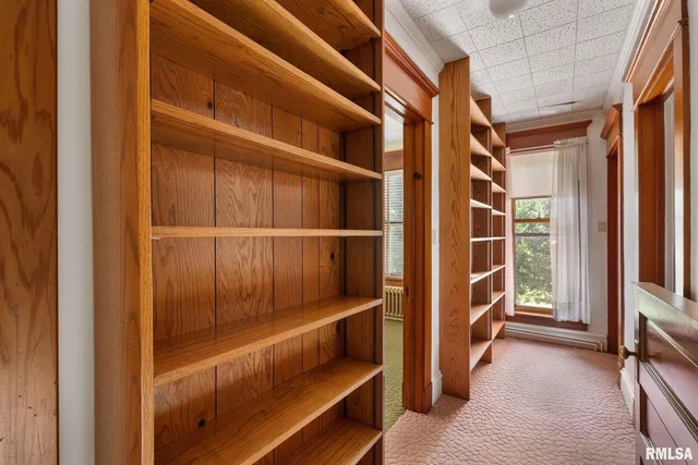 a bathroom with a sink a mirror and window