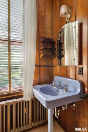 a view of a lush green forest with a sink and a yard