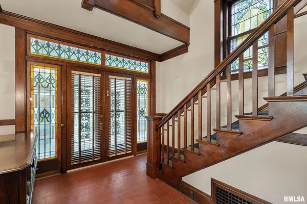 a view of a room with large windows