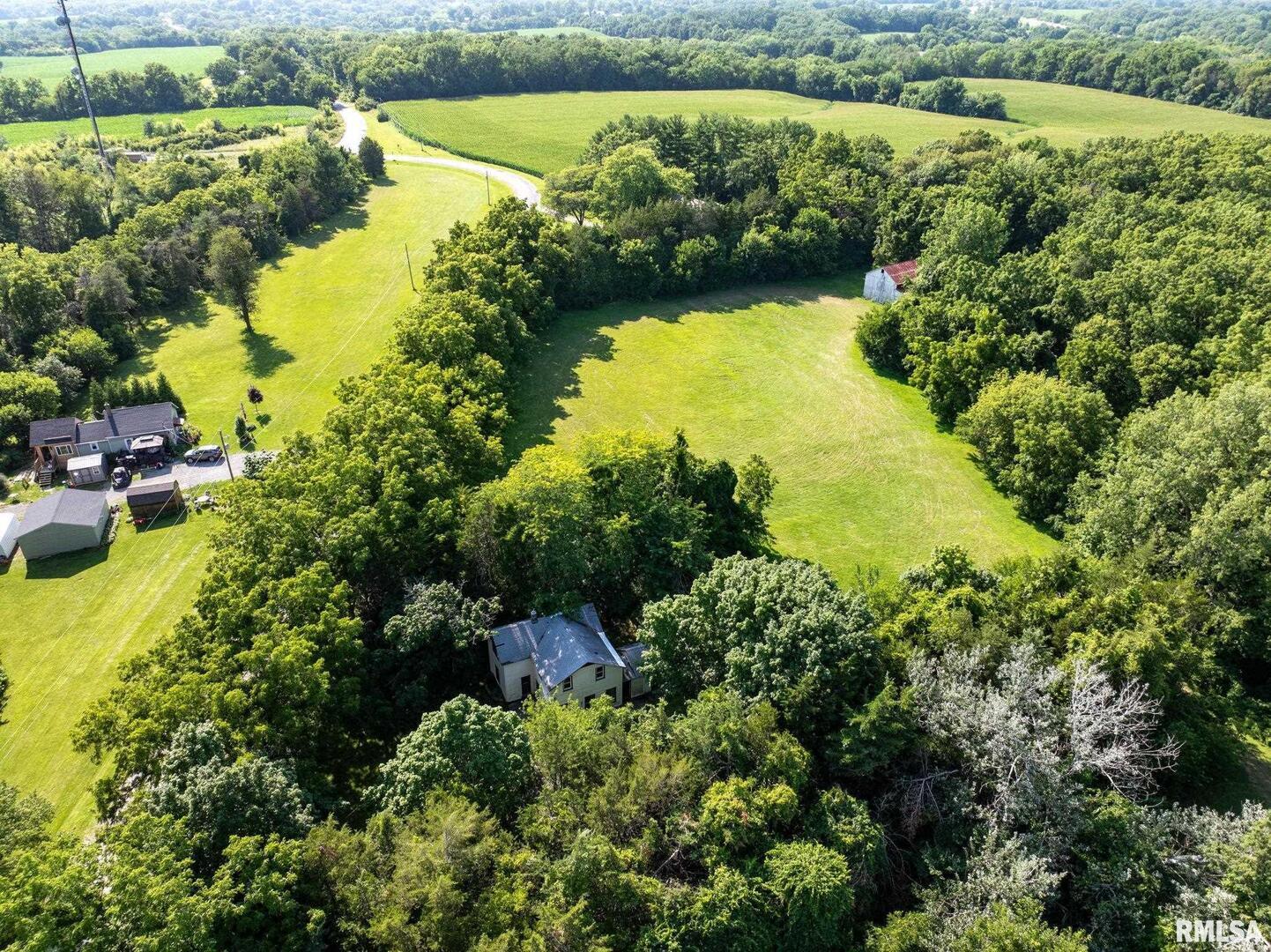 5418 Chapel Hill Road Davenport, IA 52802 - Photo 62 of 69 an aerial view of a residential houses with outdoor space and lake view
