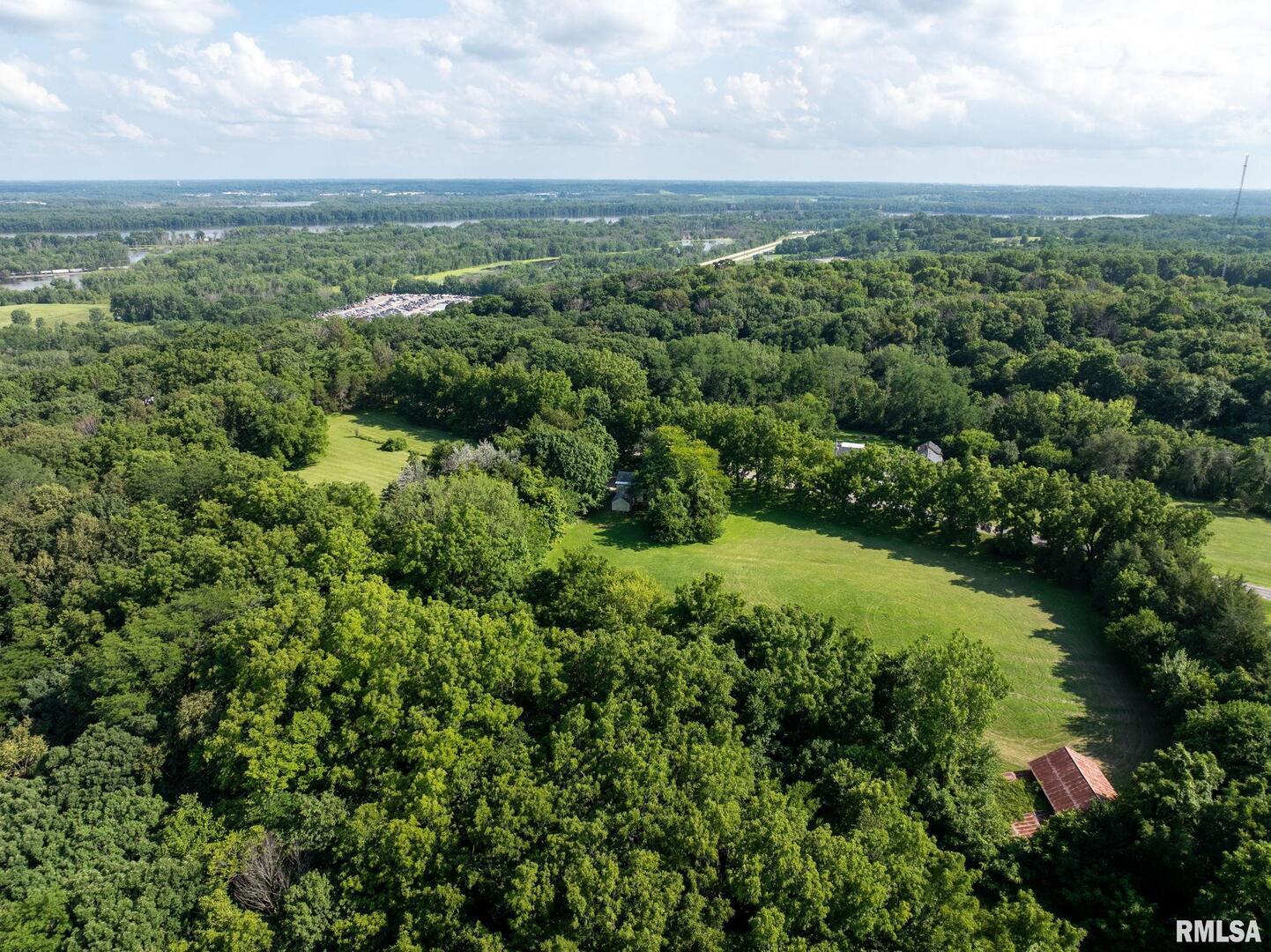 5418 Chapel Hill Road Davenport, IA 52802 - Photo 63 of 69 an aerial view of green landscape with trees houses and mountain view