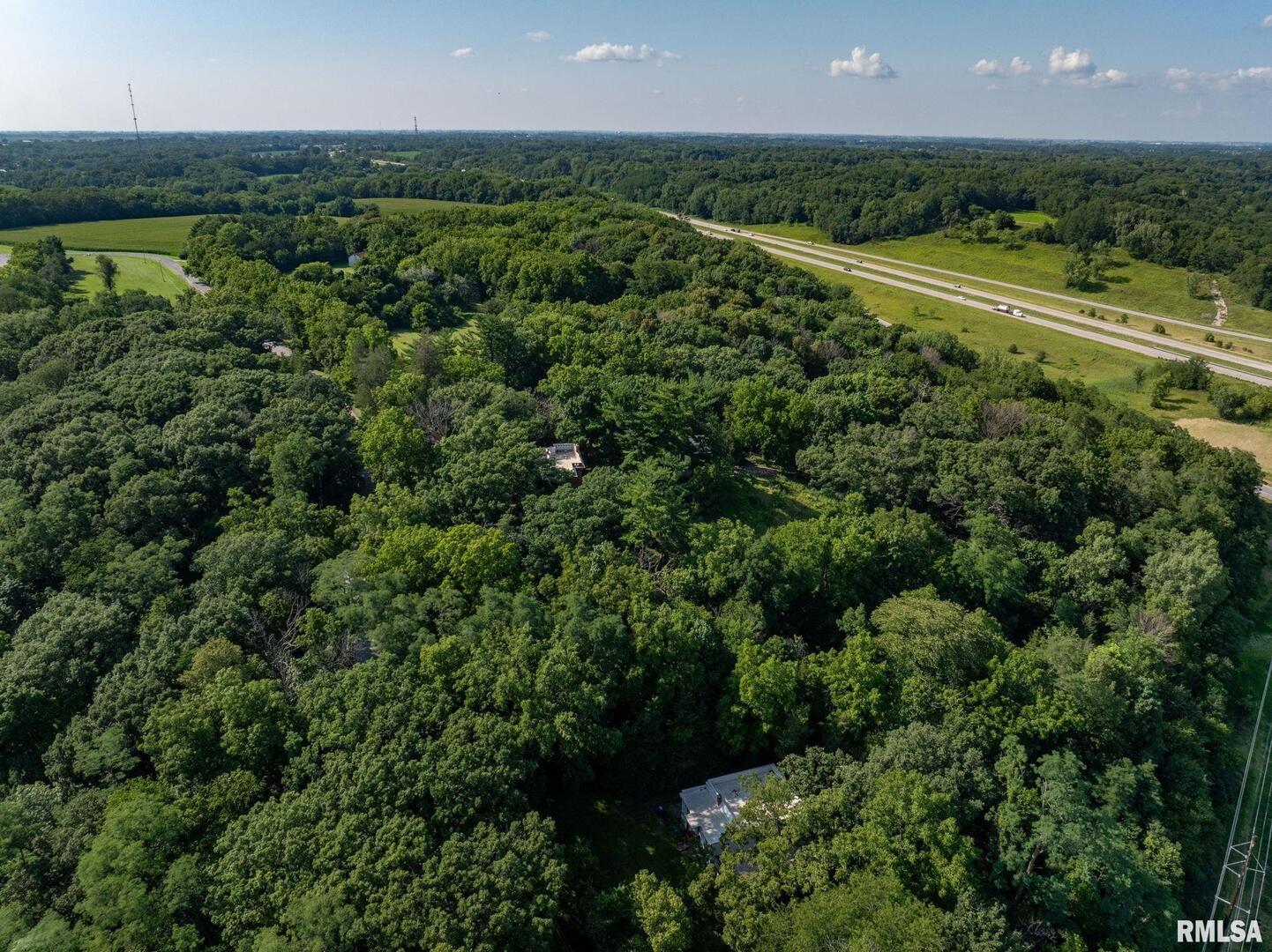 5418 Chapel Hill Road Davenport, IA 52802 - Photo 69 of 69 an aerial view of residential houses with outdoor space and trees