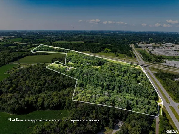 a view of a outdoor space with trees in the background