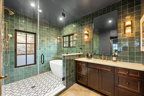 a bathroom with a sink toilet and shower