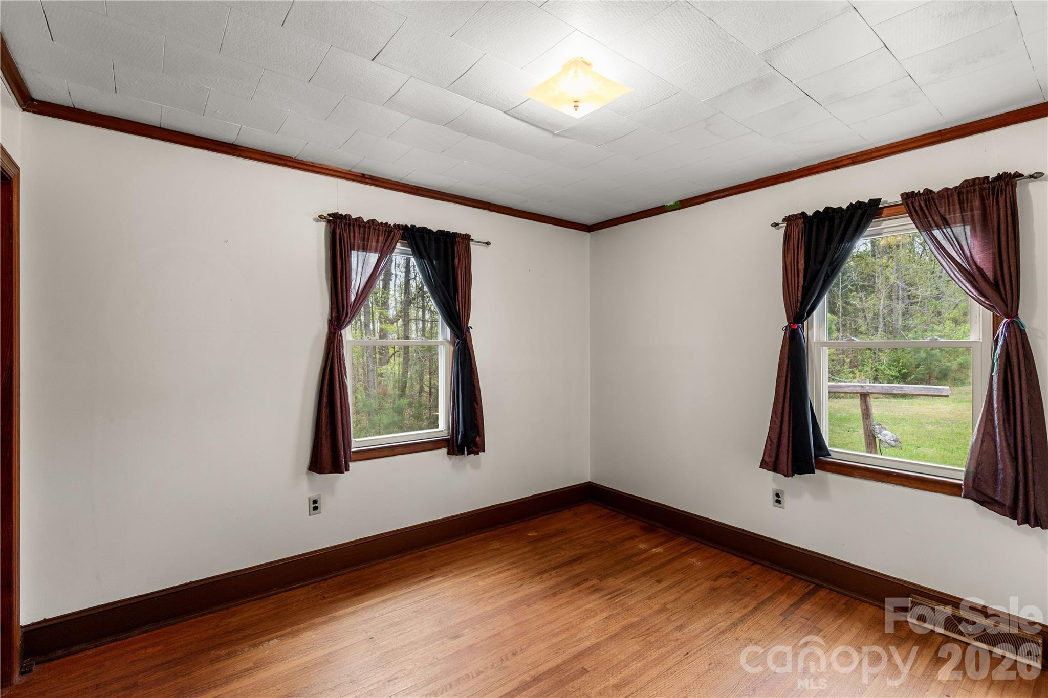 1724 State Rd S-29-39 Lancaster, SC 29720 - Photo 19 of 29 an empty room with wooden floor and windows