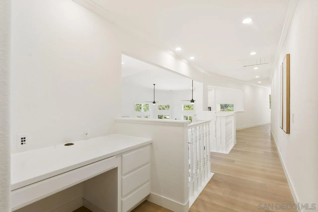 2047 Via Del Torrie Alpine, CA 91901 - Photo 19 of 53 a view of a hallway to kitchen with wooden floor