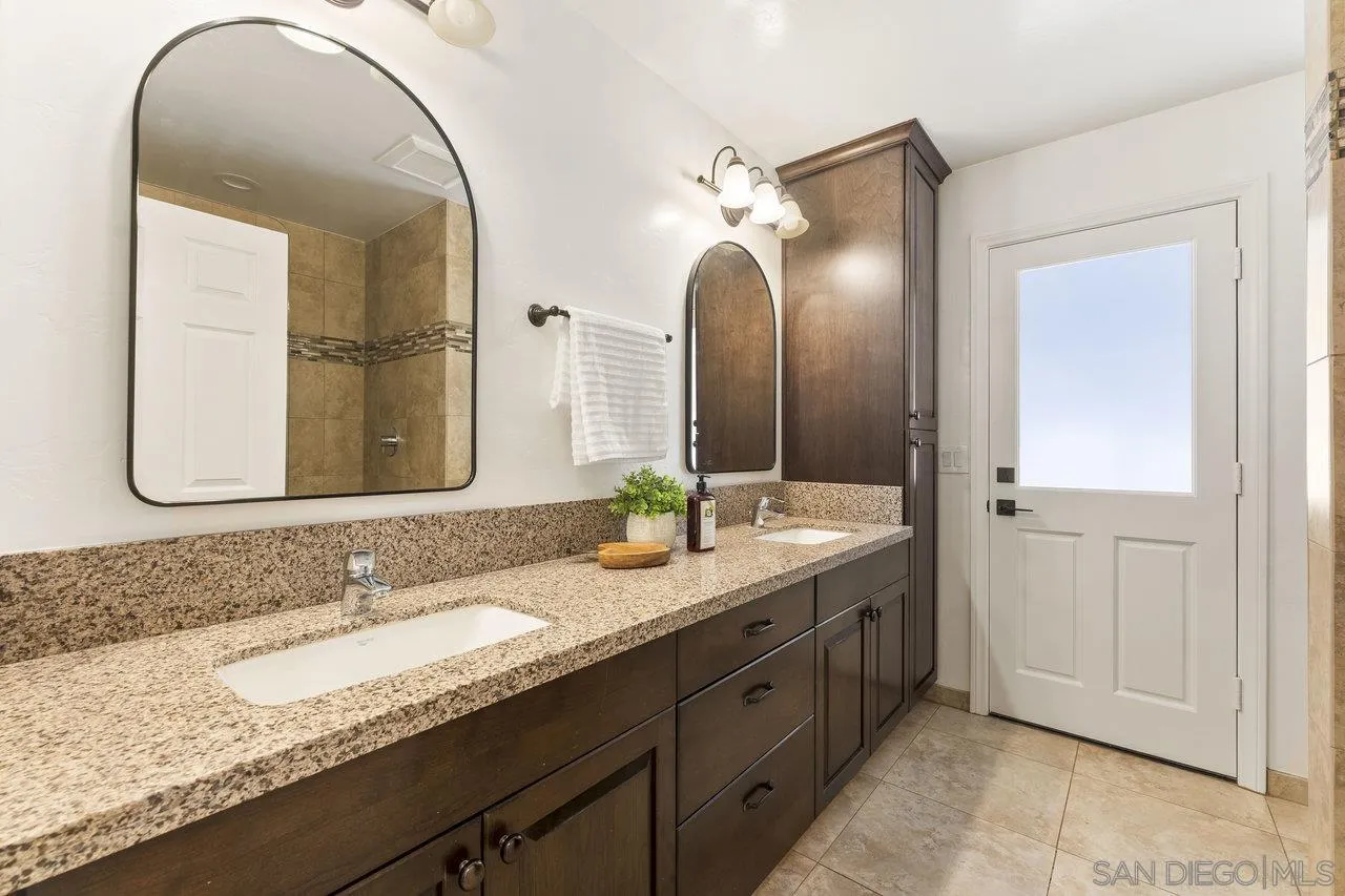 2047 Via Del Torrie Alpine, CA 91901 - Photo 22 of 53 a bathroom with a granite countertop sink double and mirror