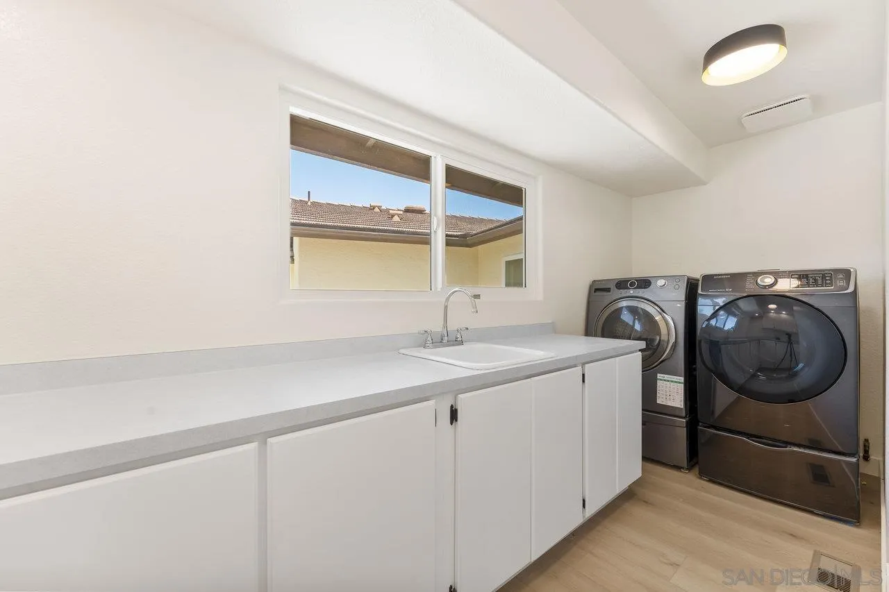 2047 Via Del Torrie Alpine, CA 91901 - Photo 26 of 53 a utility room with sink dryer and washer