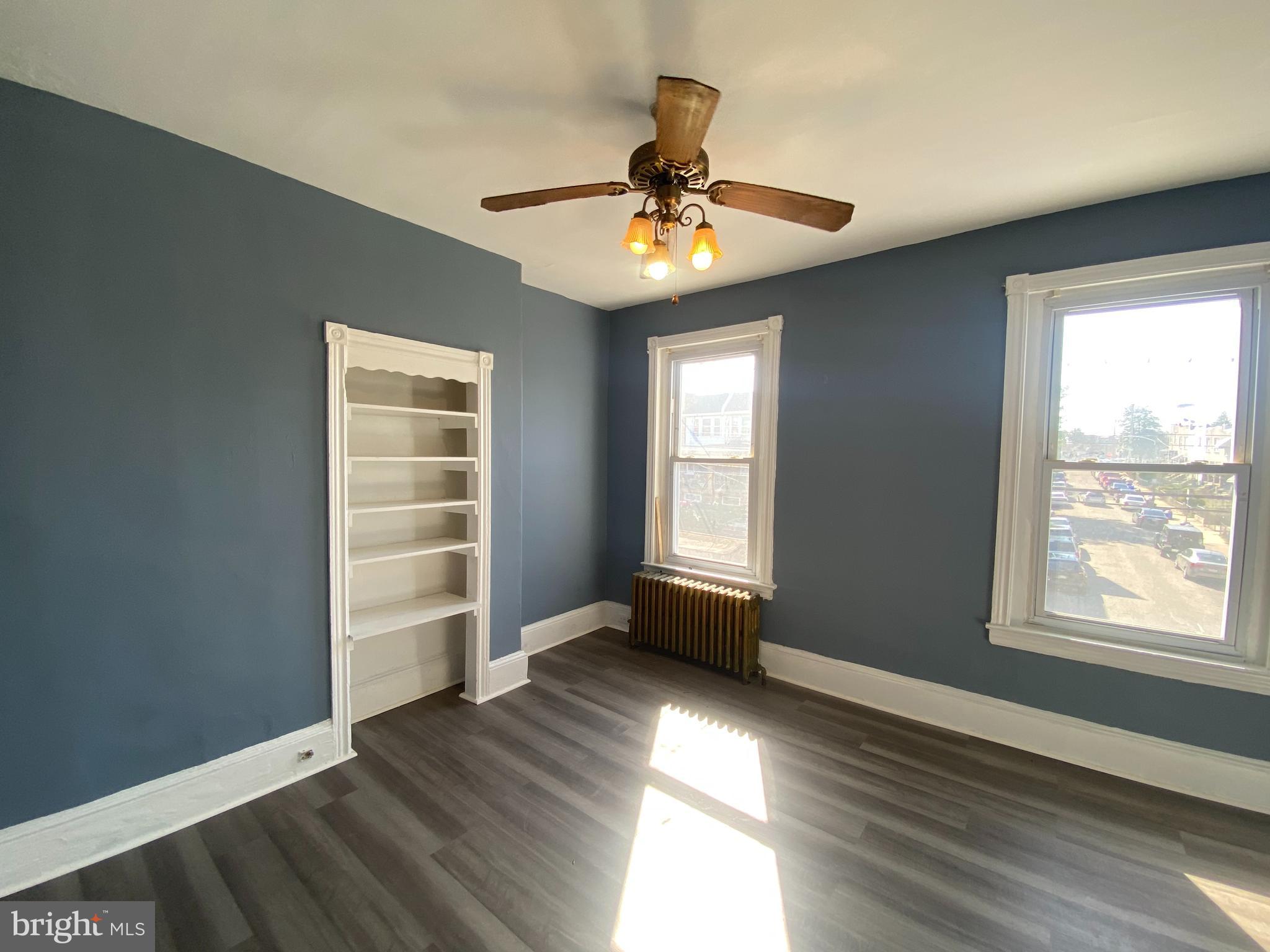 6625 Lansdowne Avenue, Unit 2 Philadelphia, PA 19151 - Photo 5 of 6 wooden floor in an empty room with a window