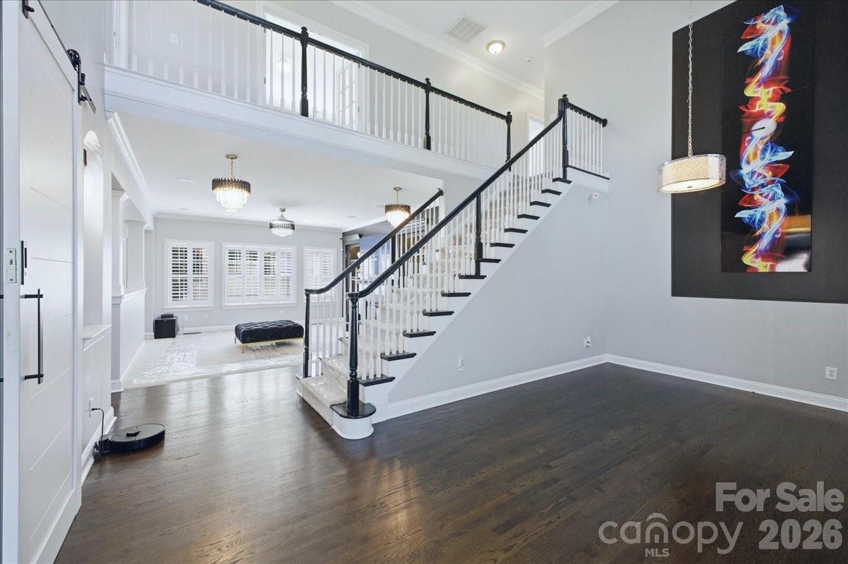1825 Laveta Road Charlotte, NC 28269 - Photo 5 of 48 a view of entryway and hall with wooden floor