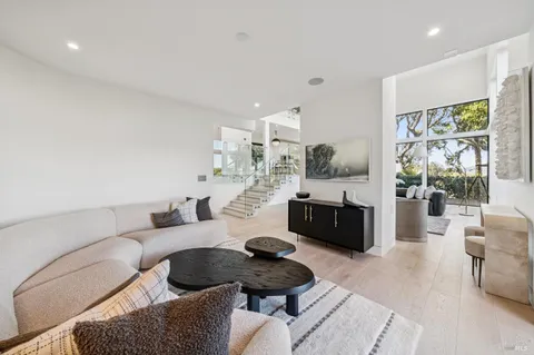 a balcony with furniture and wooden floor