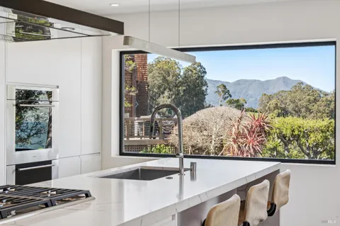 a bathroom with a double vanity sink mirror and a bathtub