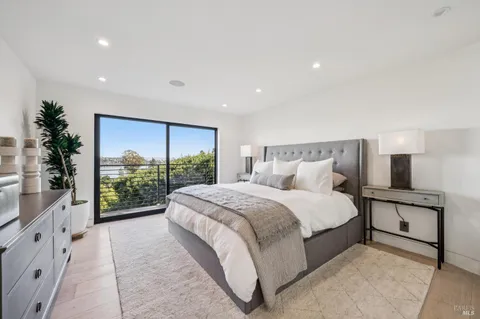 a living room with furniture and flowers