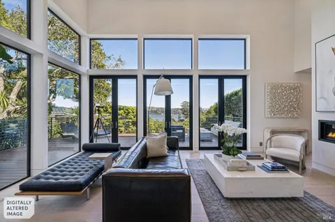 a dining room with furniture potted plants and wooden floor